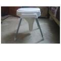 Plastic Material Over The Flush Usage Commode Seat With Four Strong Steel Legs. 