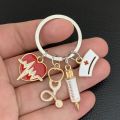 New Doctor Keychain Medical Tool Key Chain Heartbeat Stethoscope Syringe Nurse Cap Key Ring Nurse Gift DIY Handmade Jewelry. 