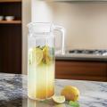 Glass Pitcher 1.1 Liter Jug with Lid Enjoy your favorite beverages featuring a practical lid for easy pouring and storage. Perfect for water, juice, or iced tea, this durable pitcher is an excellent addition to any kitchen. 