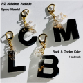 Initial keychain- Black and golden-  fancy keychain- Resin-  Epoxy - Matt Black Color. 
