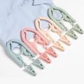Travel Portable Creative Plastic Hanger Multifunctional Simple Folding Non-slip Clothes Rack with Clips Household Space Saving Storage Tools. 