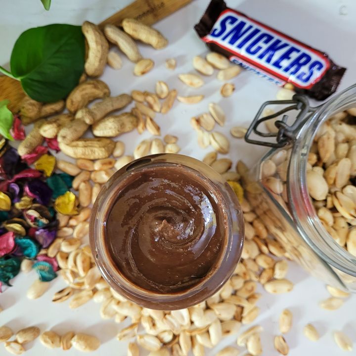 Snickers%20Flavored%20Peanut%20Butter%20-%20500g%20Jar%20-%20Made%20with%20Real%20Peanuts,%20Chocolate,%20and%20Caramel%20-%20No%20Artificial%20Flavors%20or%20Preservatives,%20No%20Added%20Sugars,%20Non-GMO,%20Gluten-Free%20-%20Image%202
