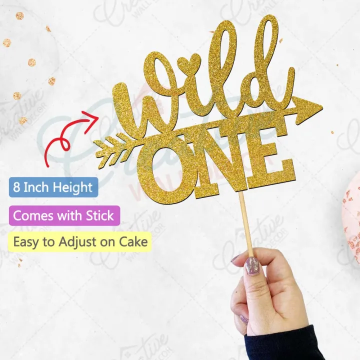 Wild%20One%20Birthday%20Cake%20Topper%20in%20Gold,%20Boy%20or%20Girl%201st%20Birthday%20topper%20for%20Party%20Celebration%20&%20cake%20Decoration%20Supplies%20-%20Image%203