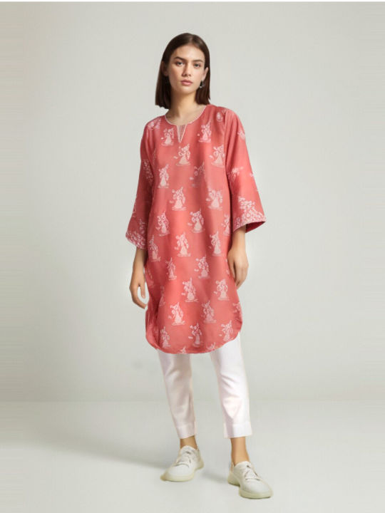 peach shirt with white lace on neck,daman and sleeves round daman