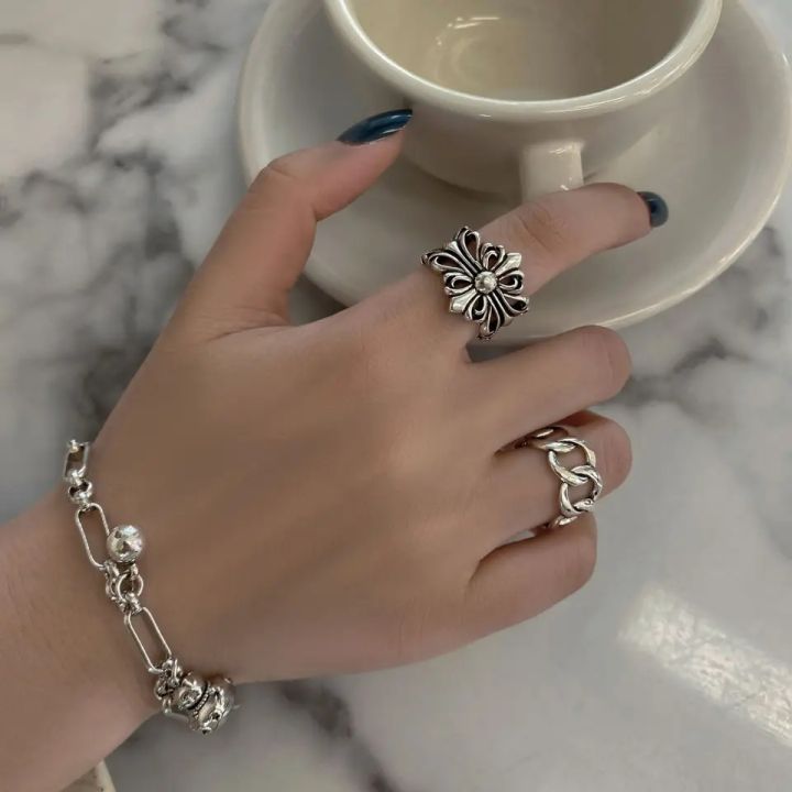 Korean version of new carved hollow fashionable and personalized geometric flower ring men and women's retro ring creativity