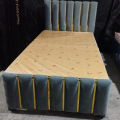 Modern single bed made with wood, furniture factory. 