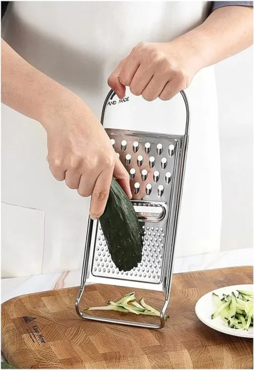Stainless%20Steel%20Grater%20with%20Storage%7C%20vegetable%20peeler%20steel%20grater%7C%20hole%20hand-held%20cheese%20grater%7C%20%20best%20for%20cheese%7C%20fruits%20and%20vegetables%203%20in%201%7C3%20Function%20Stainless%20Steel%20Grater%7C%20Slicer,%20Ginger,%20Cucumber,%20Carrot,%20Cheese%7C%20-%20Image%207