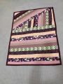Baby quilt. Long striped dark colored baby quilt.. 