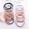 South Korea's hot selling pure hand-woven women's hair rope two-color rubber band two-strand thick high elastic hair ring children's hair accessories. 