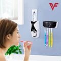 Plastic Set of Toothpaste Dispenser & Toothbrush Holder - White Automatic Tooth paste Dispenser and Tooth brush Holder Set  Wall Mounted Toothpaste Dispenser with 5 Toothbrush Holder Set  Toothpaste Squeezing Machine  Tooth brush Holder. 