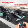 F1 Remote Control Formula Car 1:18 Scale High-Speed Spray Stunt RC Racing Car For Kids F1 Formula Smoke Spray RC Rechargeable Moving Racing Lasting 2.4G High Speed ​​Drift Sports Car For Boys Comes in Two Color Variation Best AMAZING RC Car For Gifting. 