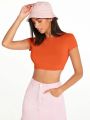SOLID MOCK NECK CROP TOP Discover the Allure of Solid Mock Neck Crop Tops". 