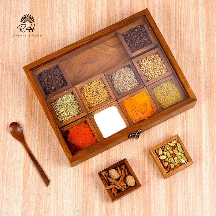Spice%20Container%20(%20Masala%20Box%20)%20Made%20of%20Pure%20Rose%20Wood%20with%20Hand%20Carving%20Having%2012%20removable%20boxes%20with%20capacity%20of%20over%20100%20Gram%20(Powder%20Spices)%C2%A0with%C2%A0Glass%C2%A0Lid%20and%20one%20Spoon%20-%20Image%207