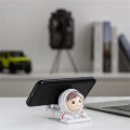 Cell Stand Hands-free Active Poses Astronaut Phone Holder. 