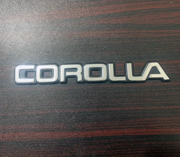 Pack%20of%202%20COROLLA%20XE-Saloon%20Monogram%20Plastic%20Emblem%20For%20Toyota%20Corolla%2089-94%20-%20Image%204