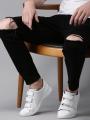 Jet Black Ripped Denim Jeans For Men. 