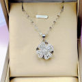 Elegant Floral Pendant Necklace with Cubic Zirconia Accents in Silver Tone. 
