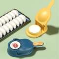 Dumpling maker with a box that can make two dumplings at once. 