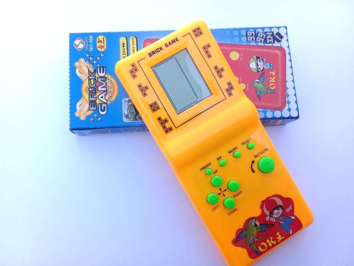 Childhood%20Classic%20Fun%20Tetris%20Hand%20Held%20Electronic%20Game%20Toys%20Brick%20Game%20NEW%20%7C%20Kids%20Electronic%20Tetris%20Game%20Handheld%20Game%20Machine%20LCD%20Educational%20Toys%20%7C%20Kids%20Super%209999%20in%201%20Multi%20Color%20(Cell%20Operated)%20-%20Image%206