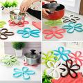 Safdar Mart- 1 Pc Kitchen Table Mat Anti Slip Silicone Plum Blossom Shape Dining Table Pot Pad Heat Proof Heat Insulation Placemat (Multicolor). 