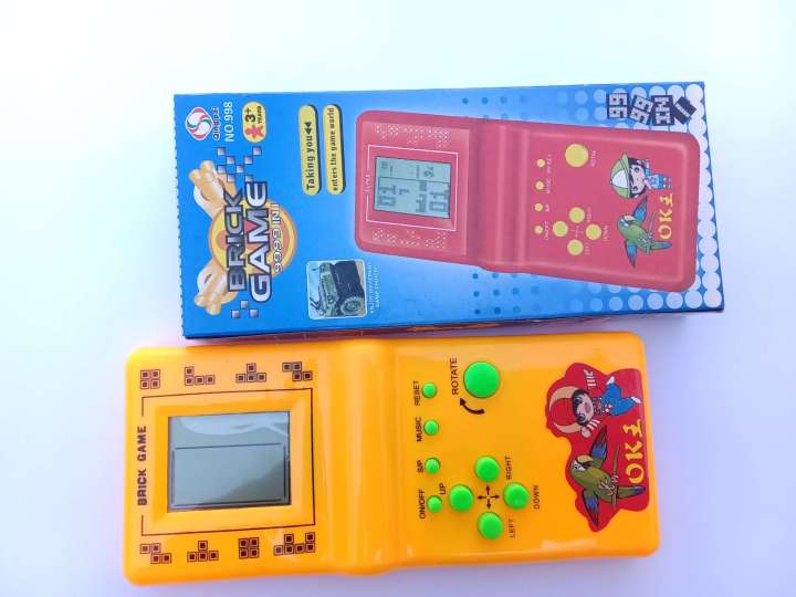 Childhood%20Classic%20Fun%20Tetris%20Hand%20Held%20Electronic%20Game%20Toys%20Brick%20Game%20NEW%20%7C%20Kids%20Electronic%20Tetris%20Game%20Handheld%20Game%20Machine%20LCD%20Educational%20Toys%20%7C%20Kids%20Super%209999%20in%201%20Multi%20Color%20(Cell%20Operated)%20-%20Image%207