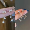 Korean fashion diamond studded bow earrings women's autumn and winter niche personality versatile long tassel stud earrings earrings trendy. 