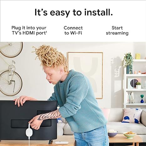 Google%20Chromecast%20-%20Streaming%20Device%20with%20HDMI%20Cable%20and%20Voice%20Search%20Remote%20-%20Stream%20Shows,%20Music,%20Photos,%20Sports%20from%20Phone%20to%20TV%20-%20Includes%20Cleaning%20Cloth,%20Pouch%20-%20HD%20Version%20-%20Snow%20-%20Image%204