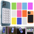 Adhesive silicon phone suction holder pads mobile phone back cover suction popet holders anti-slip single sided wall mounted phone suction cup holders phone back cover suction holding stickers. 