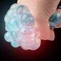Pack of 4 - Assorted Colors Glitter Mesh Squishy Balls. 