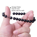 Black stone hand beats bracelet for men. 