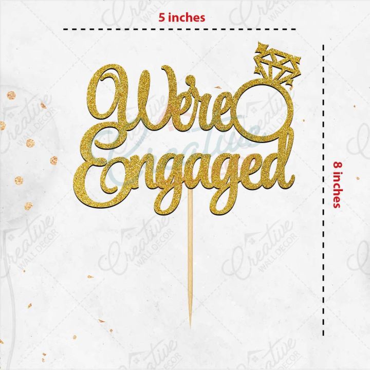 We're%20Engaged%20Cake%20Topper%20for%20Cake%20Decoration,%20Wedding%20Anniversary%20&%20Engagement%20Party%20Celebration%20Toppers%20in%20Gold%20-%20Image%202