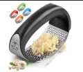 Stainless Steel Garlic Press Rocker - Premium Garlic Mincer With Silicone Peeler & Scraper - Arc Shape Design Garlic Crusher With Comfortable Grip Used For Peeling Garlic Ginger Lemmon And More. 