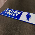 Customized ladies toilet sign. 