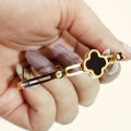 Elegant Gold-Plated Four-Leaf Clover Bangle with Black Enamel and Crystal Accents |stainless steel bracelet -Luxury Jewelry for Women |Best Gift for Girls. 