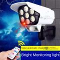 Outdoor Solar Light Motion Sensor Security Dummy Camera Wireless Flood Light IP65 Waterproof 77 LED Lamp 3 Mode For Home Garden. 