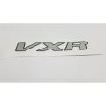 Product details of VXR Monogram Badge - Sticker - Suzuki Alto Car - Chrome Silver Premium Quality Durable Easy to Install Gives Your Car a Genuine Look Made with the Finest Quality Material Only for Suzuki. 