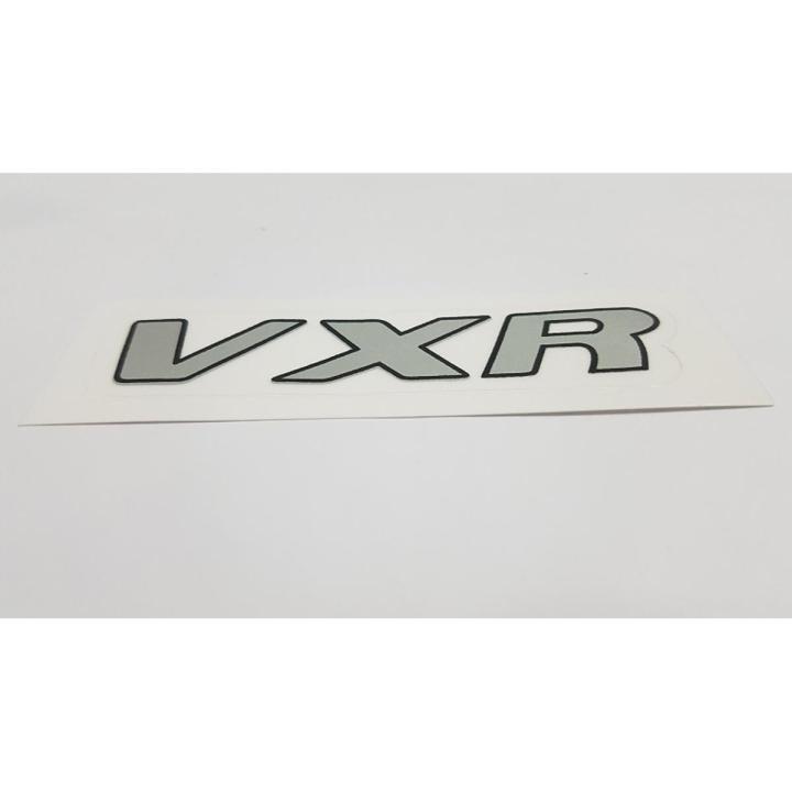 Product details of VXR Monogram Badge - Sticker - Suzuki Alto Car - Chrome Silver Premium Quality Durable Easy to Install Gives Your Car a Genuine Look Made with the Finest Quality Material Only for Suzuki
