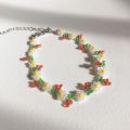 Small beaded bracelet in flower petal design. 