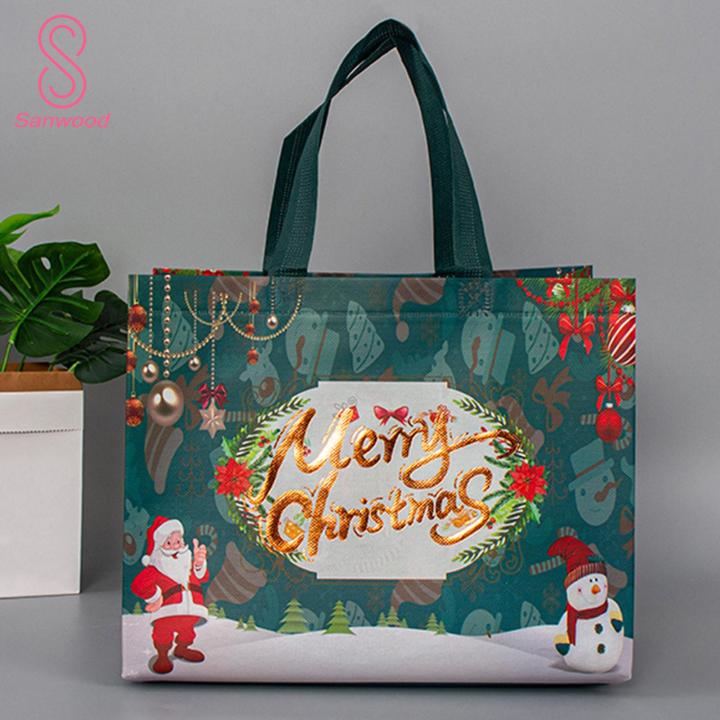 Santa Claus Gift Bags Christmas Gift Bag Festive Santa Claus Snowman Design Large Capacity Dual Handle Non-woven Fabric Candy Packaging Ideal for Southeast Asian Buyers Christmas Gift Bags