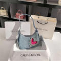 denim Shoulder bag Trendy blue Crescent moon bag Denim underarm bag for Evening events Night out Fashion shows Celebrities Fashion enthusiasts. 
