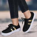 Girls sneakers black golden. 