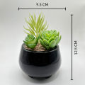 Black Ceramic Pot With Artificial Plant And Pebbles Home Decor. 
