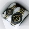 A classic analog wristwatch with a white dial, black Arabic numerals, and a white leather strap.. 
