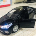 Toyota Corolla Grande Diecast Metal Model Toy Car Collection With Lights and Sounds Pull Back Action - Size Approx. 5 Inch - Black. 