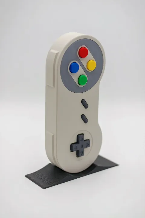 SNES%20Controller%20Headphone%20Stand%20%E2%80%93%20Retro-Inspired%20Headset%20Holder%20for%20Classic%20Gamers%20-%20Image%203