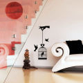 Hand hoHlding Bird Cage Wall Sticker. 