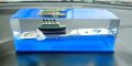 Wave Cruise Ship Decoration Unsinkable Titanic Model in a Clear Motion Bottle for Stress Relief, Office or Home, Gift & Paperweight - Soothing Blue Liquid with Floating Ship Design. 