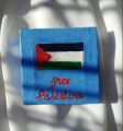 Palestine crochet keychain and painted canvas. 