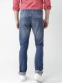 The-Ajmery Medium Blue Ripped Denim Jeans For Men. 