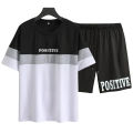 Summer Men Letter Graphic Color Block Tee & Drawstring Waist Shorts Track suit for Summer. 